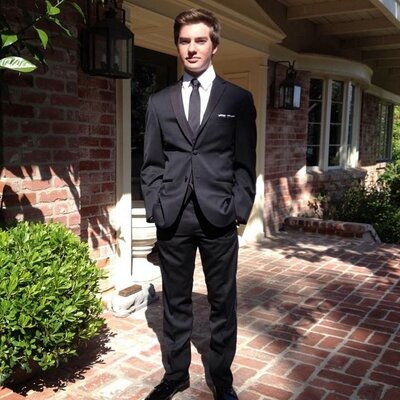 Will Bakula dressed up in a black suit.